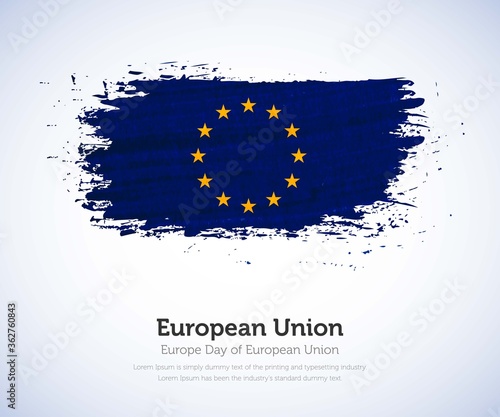 Europe day of European Union country. Abstract flag in shape of paint brush stroke with shiny colored background