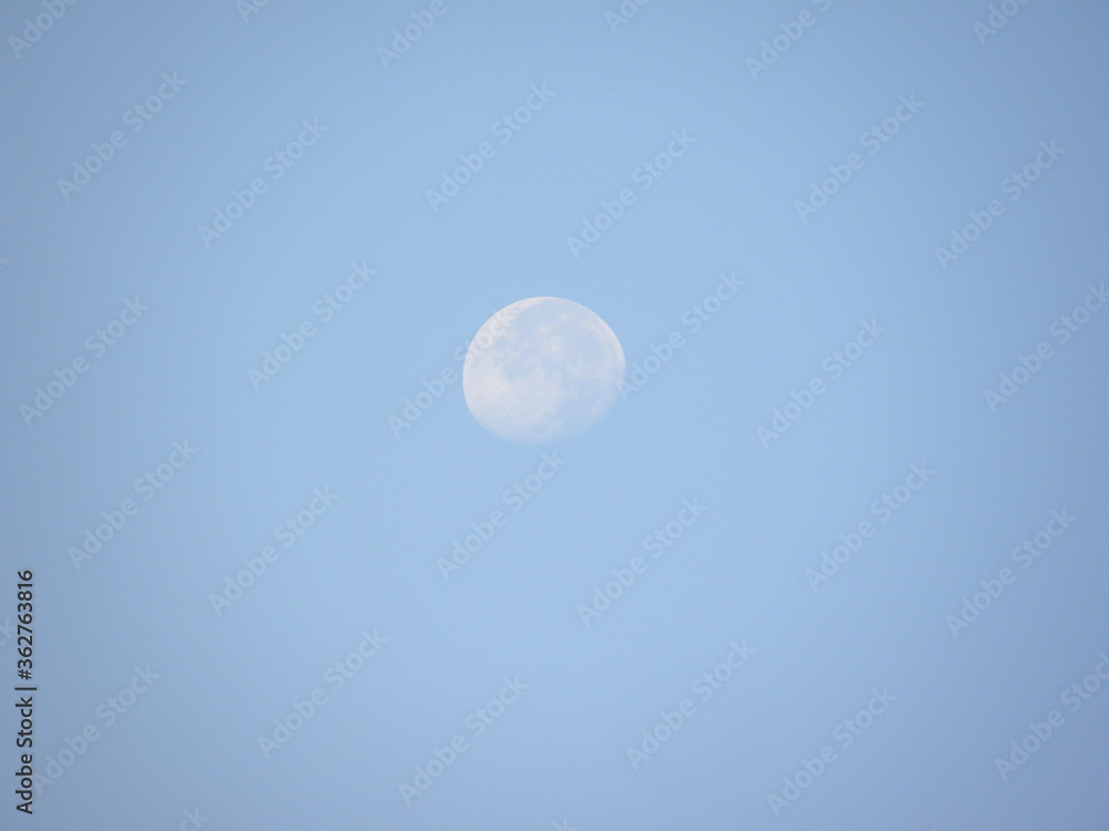 Abstract Moon on blue sky background Abstract Moon on blue sky background