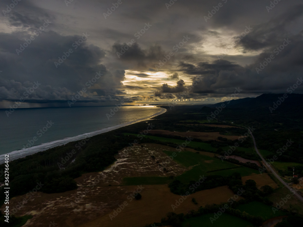 Beautiful aerial view of a Strong rain storm in the middle of the ocean, near the beach of Costa Rica Beautiful aerial view of a Strong rain storm in the middle of the ocean, near the beach of Costa Rica