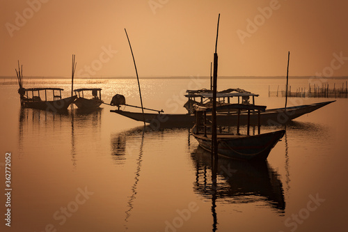 Golden Sunrise at the Asia's Largest Salt Water Lake in Chilika, Odisha, India photo