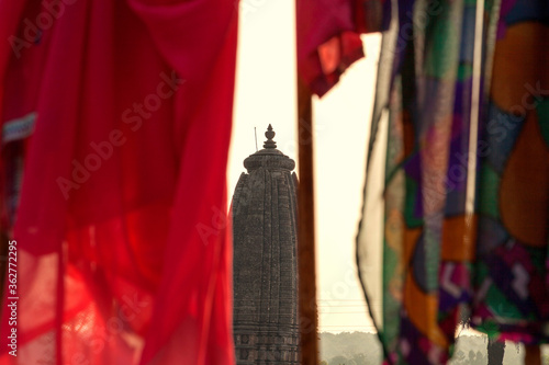 Indian women pilgrims drying their colorful sarees under sun after taking holy bath. photo