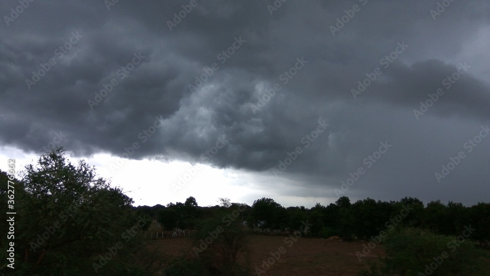 Beauty of Nature. storm clouds over the farm