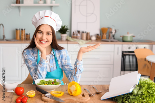 Young woman making tasty sa...