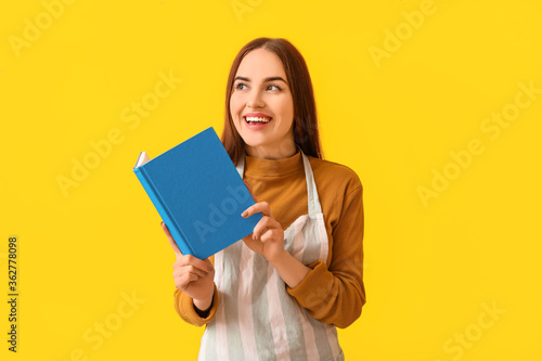 Young woman with recipe boo...