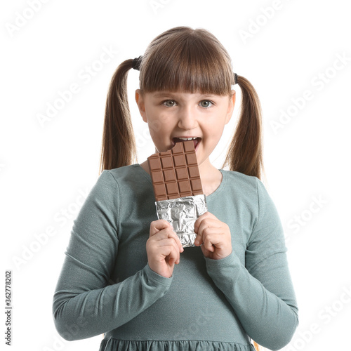 Cute funny girl with chocolate on white background