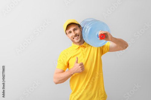 Delivery man with bottle of...