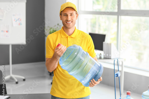 Delivery man with bottle of...
