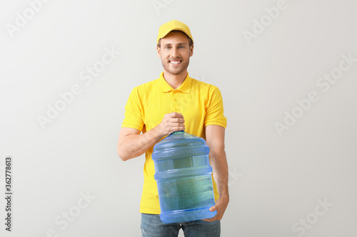 Delivery man with bottle of...