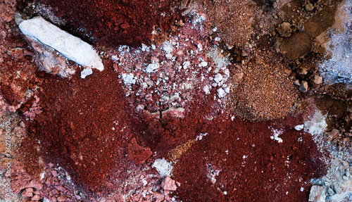 textures of various clay layers underground in  clay quarry after  geological study of  soil. colored layers of clay and stone in  section of  earth, different rock formations and soil layers.