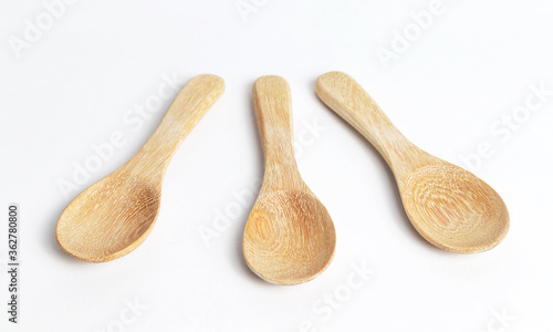 Small wooden spoon isolated on white background
