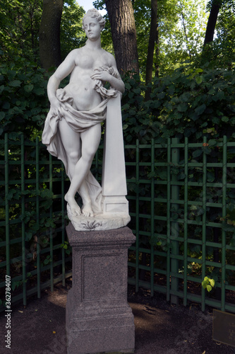 Saint-Petersburg, Russia - July 28, 2019: Marble Sculpture of the  goddess of GLory by Pietro Baratta, Italy, 1718. Summer Garden, St. Petersburg, Russia. photo