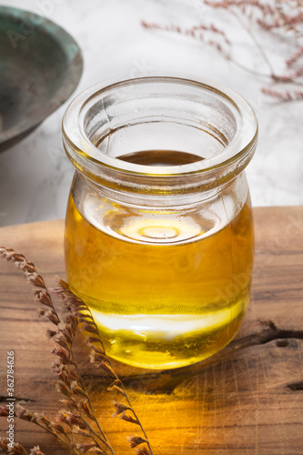 Natural olive oil concept in glass cup