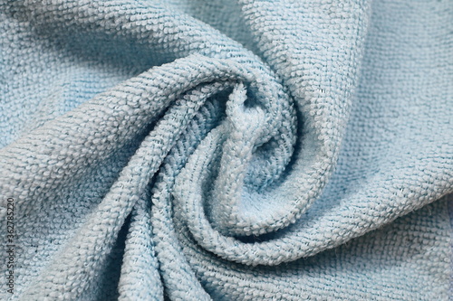 use a twisted blue towel with folds as a background
