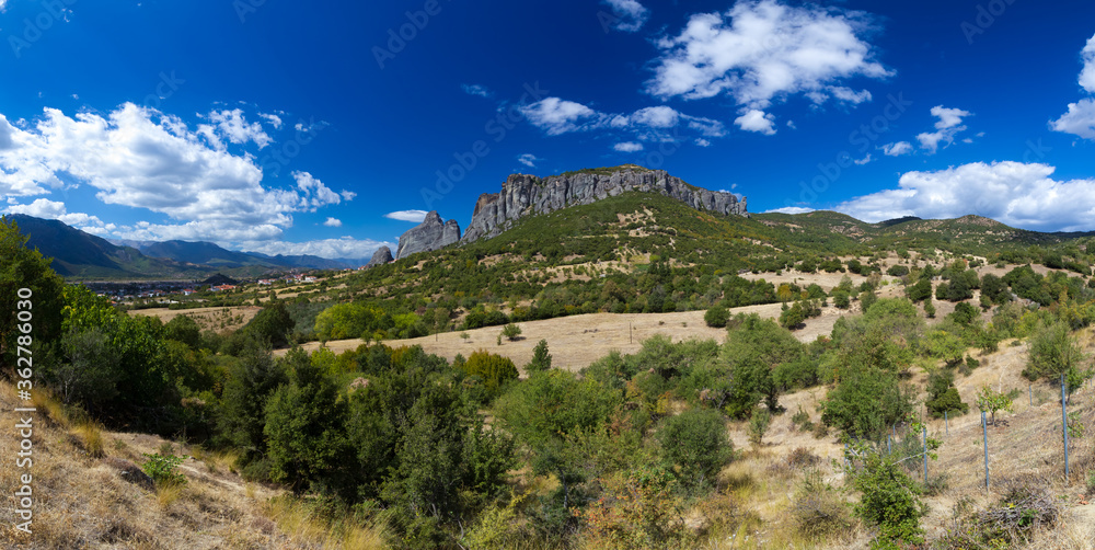 Greece. Panorama with rocks on the background of the sky. Greek landscape on a summer day. Nature of Greece. Traveling to the regions of Greece. Nature of Europe. Tourism in Europe.