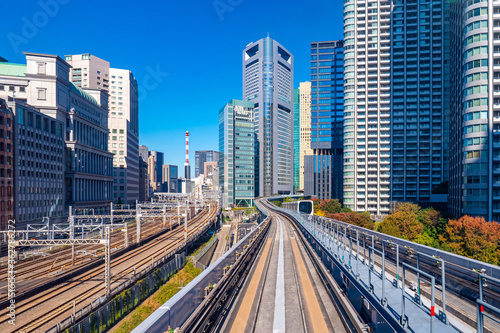 Japan. Railways of Tokyo. Railways of different generations are nearby. Roads for high-speed trains. Trestle in downtown Tokyo. City landscape from Japan.Tokyo on the background sky. Travel by train
