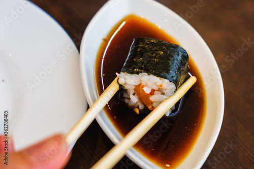 Bowl with tasty soy sauce a...
