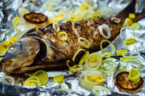 carp whole foil dinner food. dish closeup.