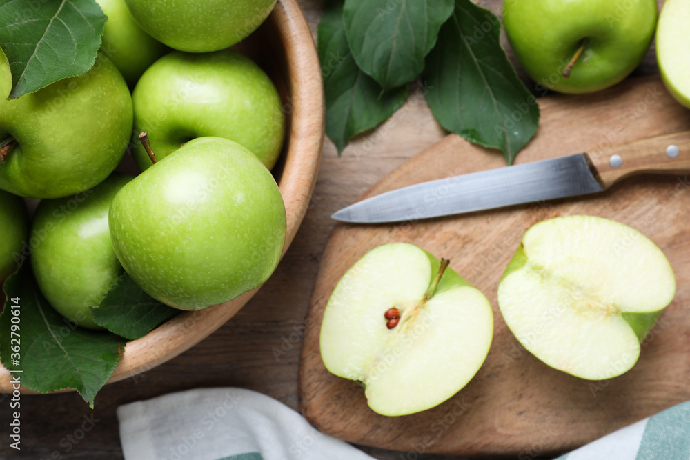 Flat lay composition with juicy green apples on wooden table Flat lay composition with juicy green apples on wooden table