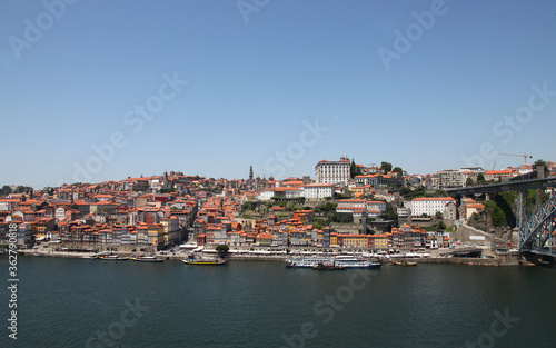 Sights and scenes of Porto in Portugal  featuring buildings  river and roads