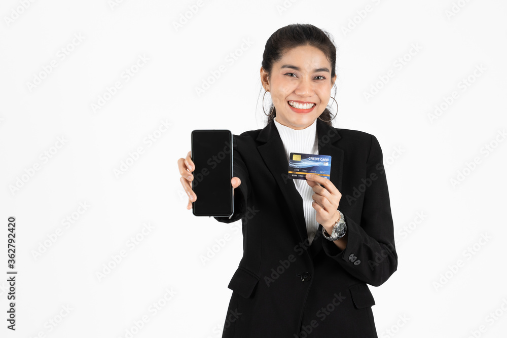 Attractive happy young Asian business woman showing screen of mobile smart phone over white isolated background. Social network, Shopping online concept. Attractive happy young Asian business woman showing screen of mobile smart phone over white isolated background. Social network, Shopping online concept.