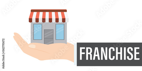 Franchise business concept. Hand holding shop isolated on white background. Franchise marketing system.