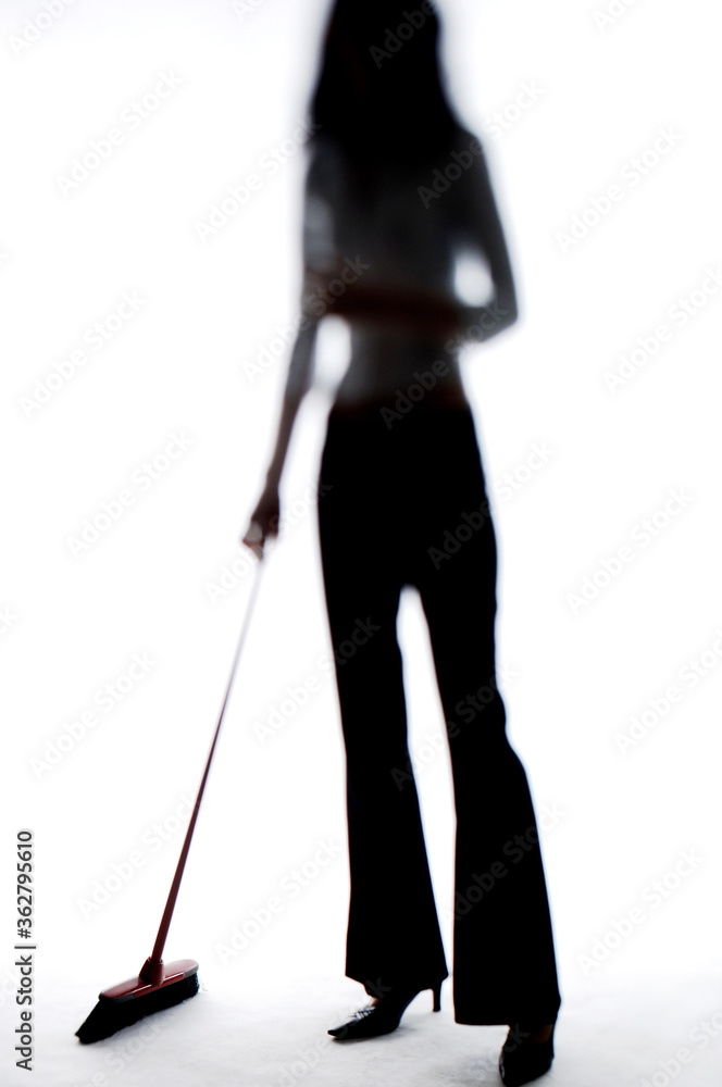 Businesswoman sweeping the floor Businesswoman sweeping the floor