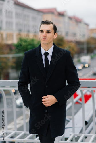 Man in a stylish suit. Businessman in an autumn city, fashion