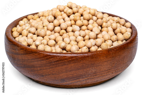 A heap of raw chickpeas in wooden bowl