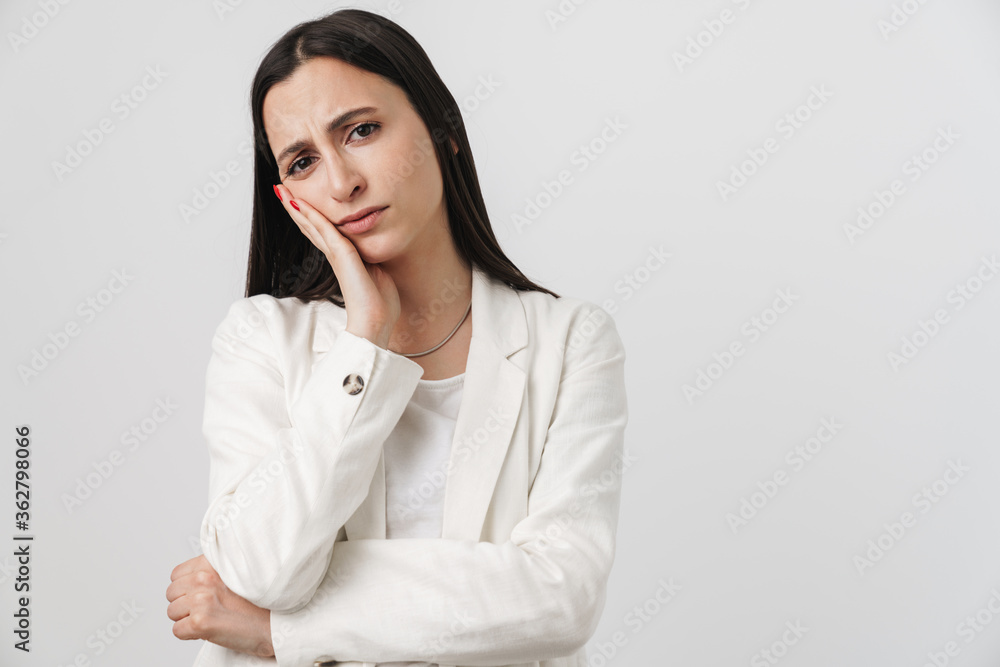 Photo of unhappy businesswoman propping her head and looking at camera Photo of unhappy businesswoman propping her head and looking at camera