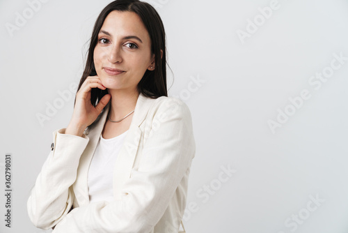 Photo of happy attractive businesswoman looking at camera and smiling