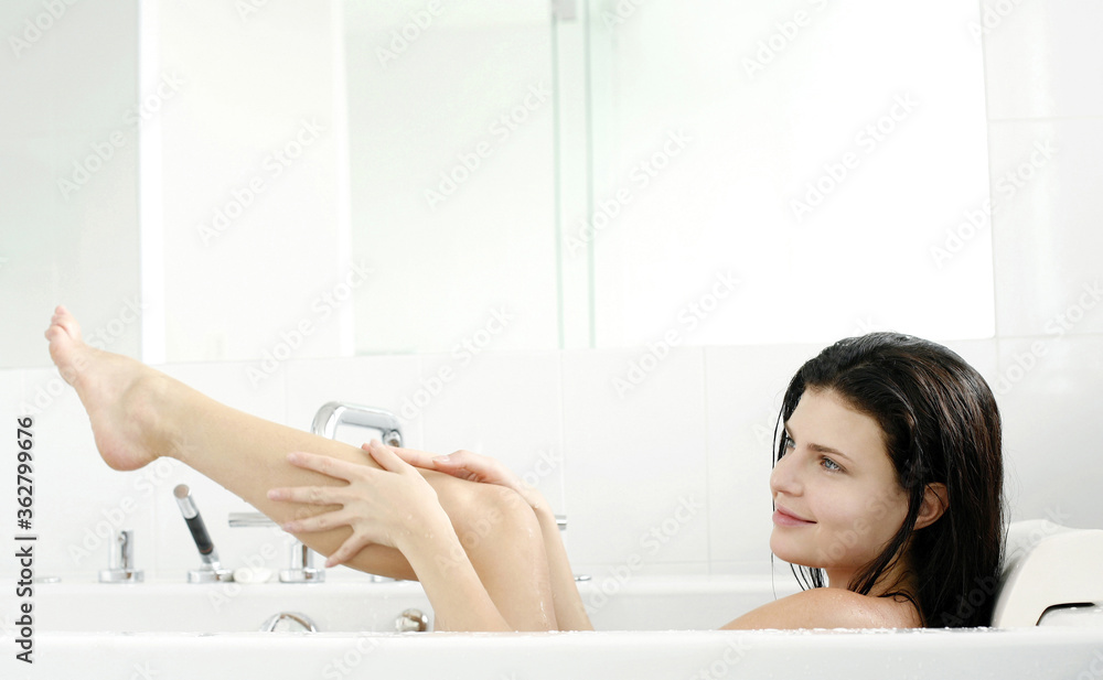 Woman relaxing in the bathtub Woman relaxing in the bathtub