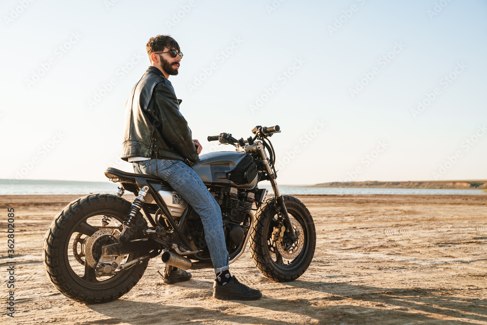 Fototapeta premium Handsome young man wearing leather jacket