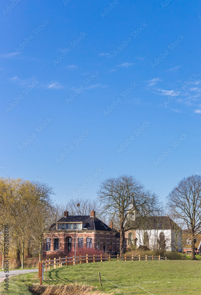 House and church of the small village Jukwerd in Groningen, Netherlands