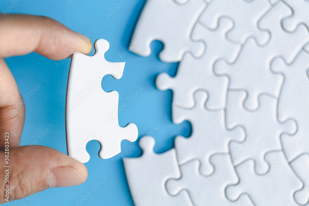 Human hands holding white jigsaw with word problem & solution. symbol of association and connection. business strategy. Human hands holding white jigsaw with word problem & solution. symbol of association and connection. business strategy.