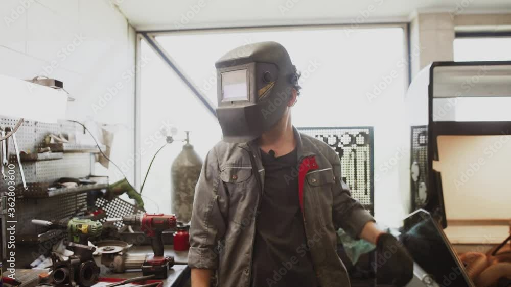 Auto mechanic repairing a car in a workshop.car repair concept Auto mechanic repairing a car in a workshop.car repair concept