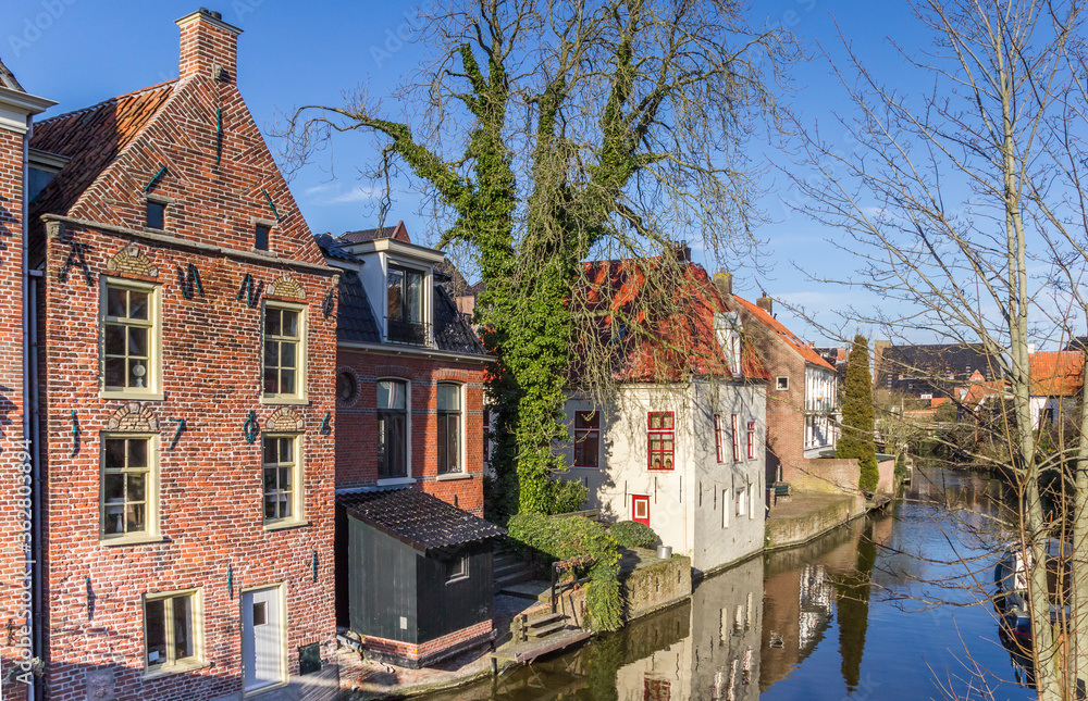 Historic houses at the Damsterdiep river in Appingedam, Netherlands Historic houses at the Damsterdiep river in Appingedam, Netherlands