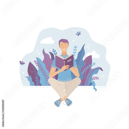 Young smiling man reading book