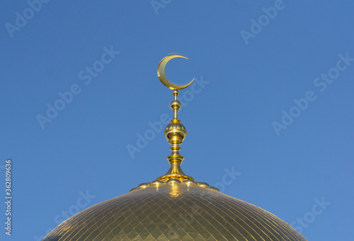 Muslim mosque on a background of blue sky. Muslim and Islamic architecture