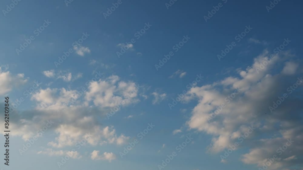 Sky becomes lighter. Clouds are flying quickly on the blue sky Sky becomes lighter. Clouds are flying quickly on the blue sky