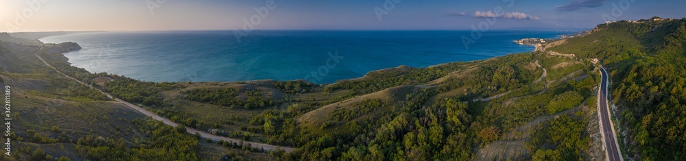 Aerial view over the coast road way from Balchik Bulgaria at the shore of Black Sea during an amazing summer morning Aerial view over the coast road way from Balchik Bulgaria at the shore of Black Sea during an amazing summer morning