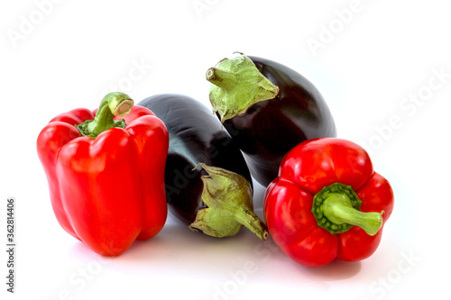 Healthy food, vegetable, paprikas and eggplants on a white background photo