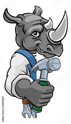 A rhino cartoon animal mascot carpenter or handyman builder construction maintenance contractor peeking around a sign holding a hammer