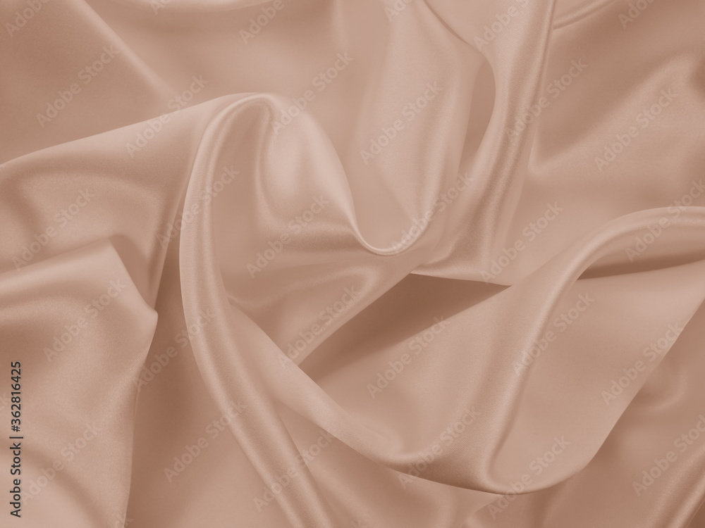 Naklejka premium Photography of beautiful smooth elegant wavy beige / light brown satin silk luxury cloth fabric texture, abstract background design. Copy space. Card or banner