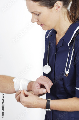 Female nurse treating a patient