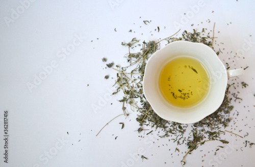 Tea with thyme on a background of dried thyme
