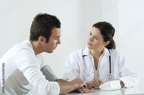 Female doctor explaining to her patient about his pressure test