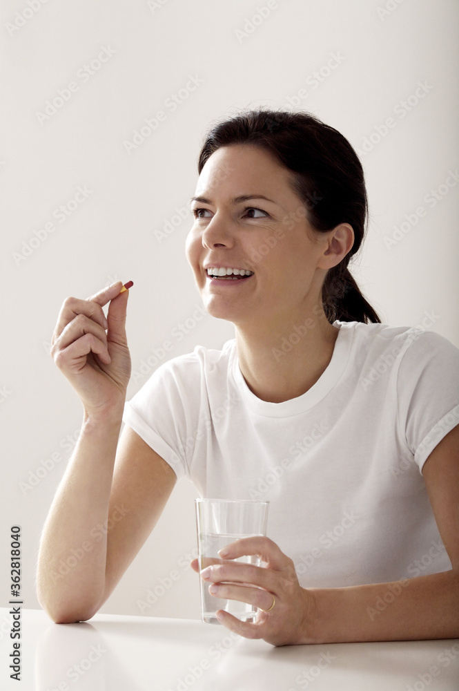 Woman about to take her medication