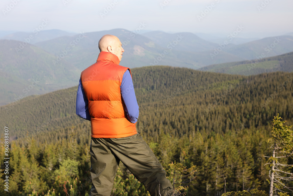 Active healthy man hiking in beautiful forest Active healthy man hiking in beautiful forest