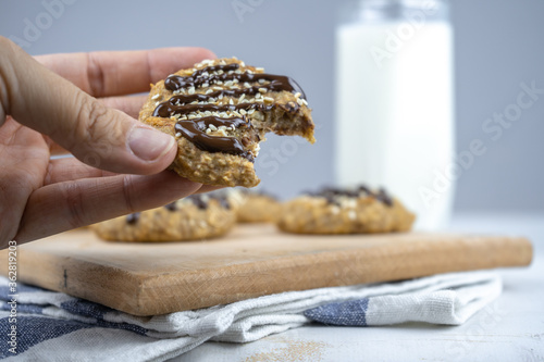 healthy banana oatmeal cookies with chocolate, healthy dessert with milk for breakfast