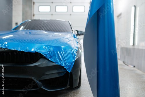 Car wrapping, protective foil or film installation photo